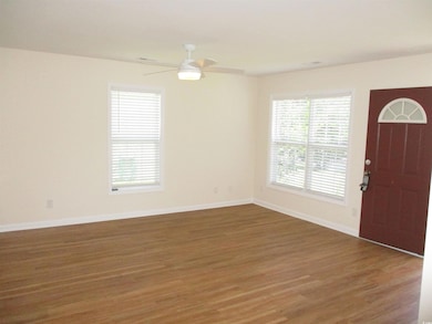 Foyer entrance featuring wood finished floors and ceiling fan