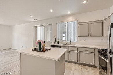 Kitchen with stainless appliances and an undermoun