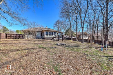 Privacy fenced backyard with firepit out back. Huge yard!
