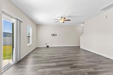 Spare room with ceiling fan and dark hardwood / wo