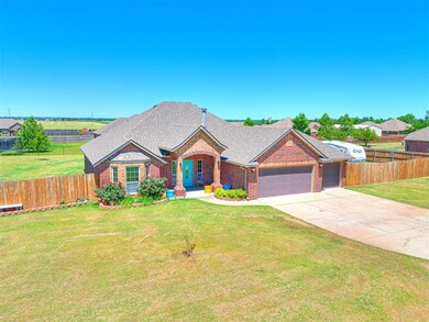 View of front of home with a front lawn and a gara