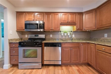 Kitchen with granite counter tops, stainless steel