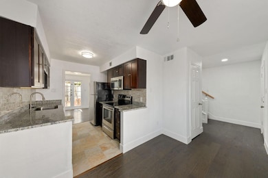 Kitchen with stainless steel appliances, visible v
