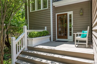 A large welcoming front porch with planter box.