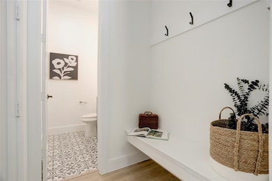 There is a half bath on the 1st floor adjacent to