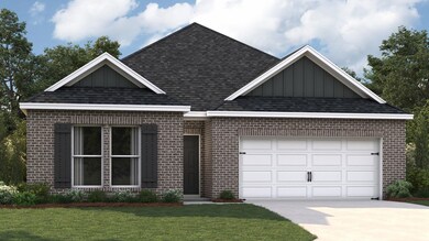 View of front of house with a garage and a front l