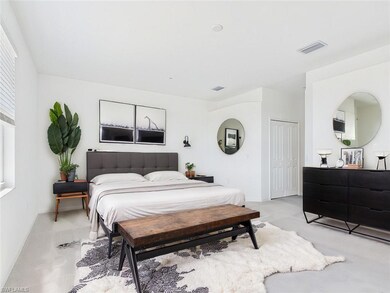Bedroom featuring baseboards, visible vents, and l