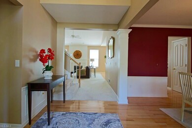 Enter the two story foyer to a vaulted great room and dining room