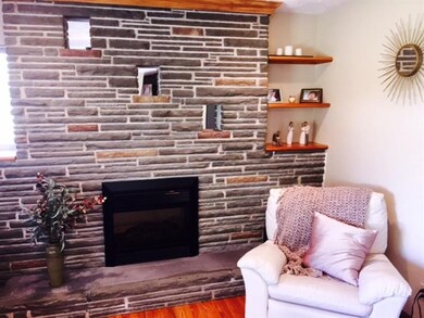 Enjoy a good book as you warm your toes by the fir