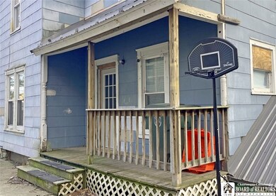 Side porch and entry to the lower level