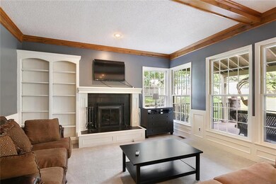 Hearth Room has built ins and a fireplace that ope