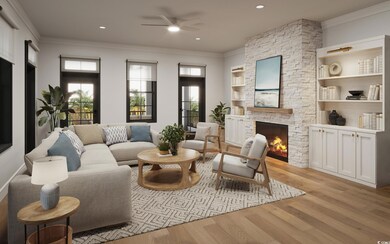 Living room featuring built in shelves, light hard