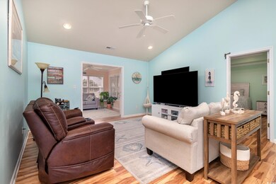 Living area featuring light wood-style flooring, a