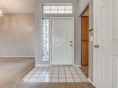 Foyer with light carpet