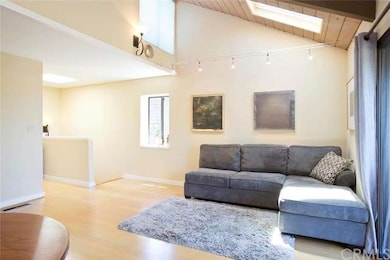 Living room with high windows and custom lighting