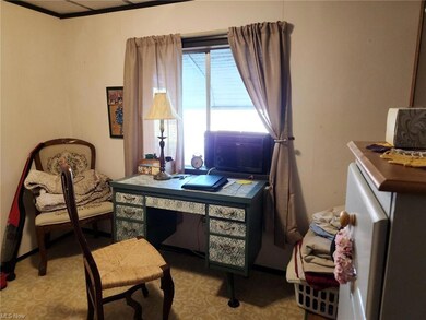 Bedroom with light carpet and crown molding