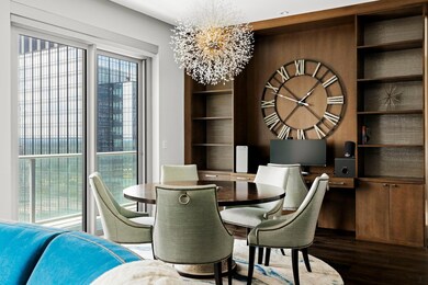 Dining space with dark wood-style flooring, a cha