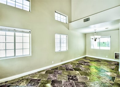 Impressive formal front room offering soaring ceil