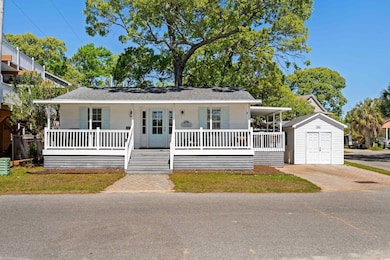 View of front facade with a porch and a shingled r