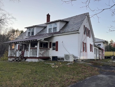 Cape With Attached Garage And Storage