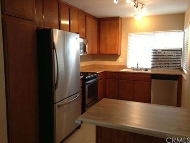 Kitchen with Stainless Steel appliances. Fridge is