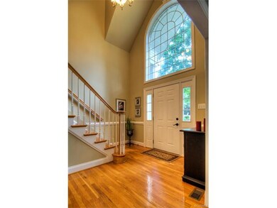 Inviting 2 story Foyer with Hardwood Floors and Pa