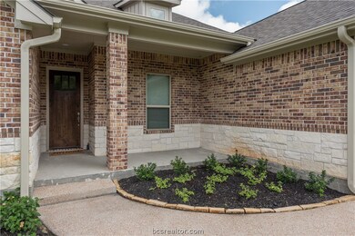 Covered front porch with room for a chair or two t