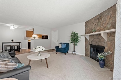 Spacious living room with Woodburning fireplace for winter months and Central AC for summer months!