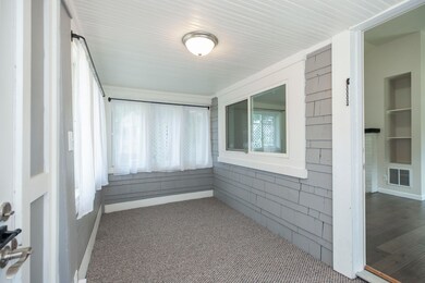 Enclosed front porch with new carpet