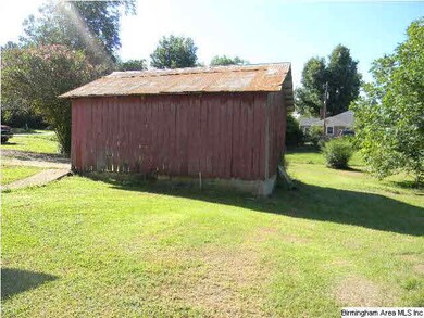 The outbuilding is the beginnings of a good shed f
