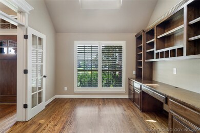 Separate office with built-ins overlooks front yar