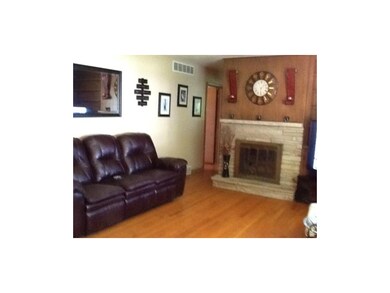 Living Room showcases a gorgeous stone fireplace!