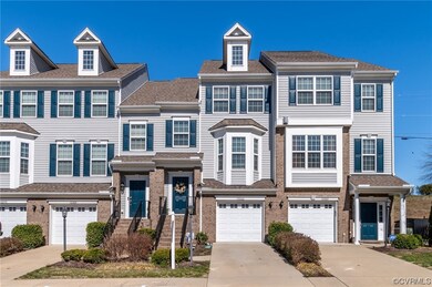 Townhome / multi-family property featuring a garag