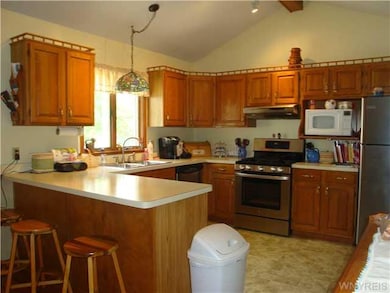 Kitchen. Well appliance kitchen has breakfast bar,