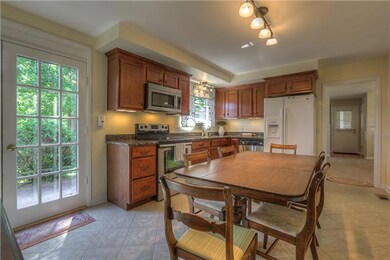 Renovated kitchen with new cabinets, granite and stainless steal appliances.