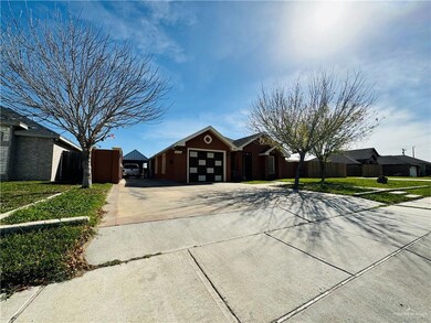 Single story home featuring a garage and a front lawn