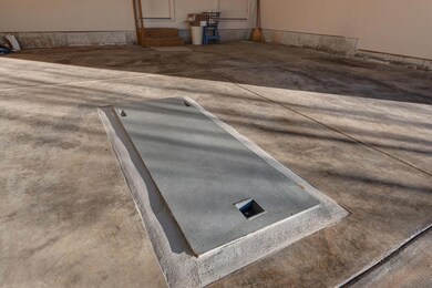 Storm shelter in garage floor