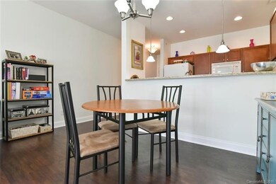 Kitchen opens to dining room with large breakfast 