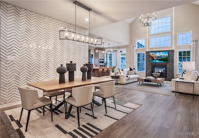Dining area with hardwood / wood-style floors, hig