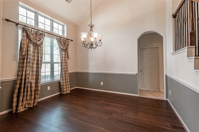 Formal dining with opening to kitchen.