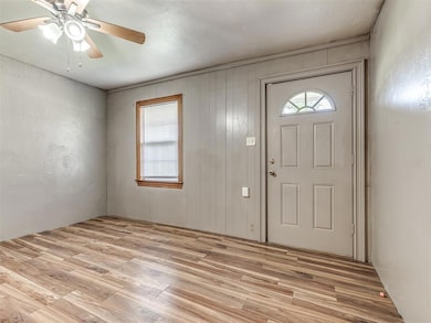Entrance foyer featuring light wood-type flooring and ceiling fan