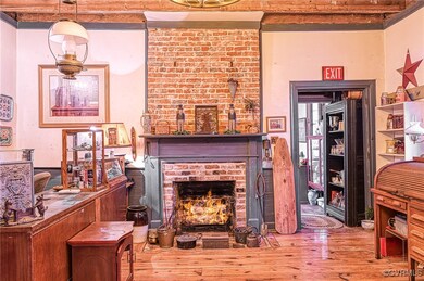 Heart of pine floors, beamed ceiling, fireplace