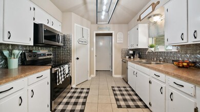 The kitchen boasts new appliances