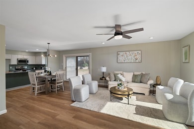 The living room, dining room, and kitchen all flow together seamlessly.