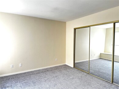 Unfurnished bedroom with a closet, baseboards, and