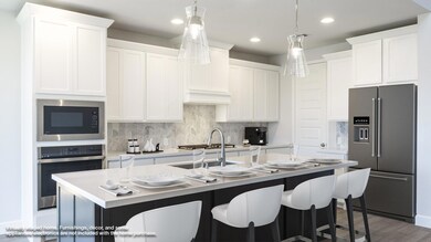 Kitchen with appliances with stainless steel fini