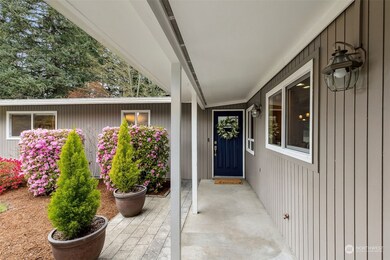 Covered walkway to entry under these fantastic large eaves that wrap around the entire house!
