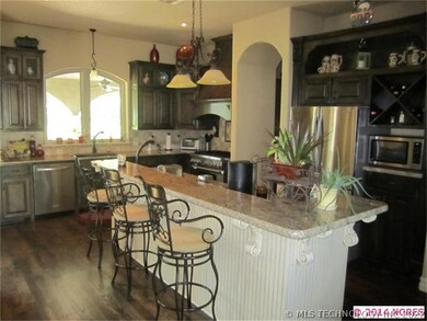 Spacious kitchen with granite, hardwood floors and