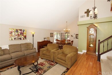 Living Room and Dining Room with wood laminate flooring.