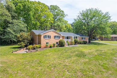 Ranch-style home with brick siding and a front law